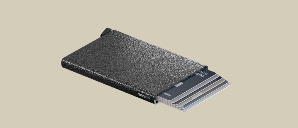 Secrid hammered aluminum card holder highlighting card capacity. color charcoal.